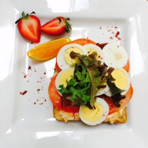Society Bakery's homemade pimento cheese on toast, with hardboiled eggs, bacon, lettuce and tomato